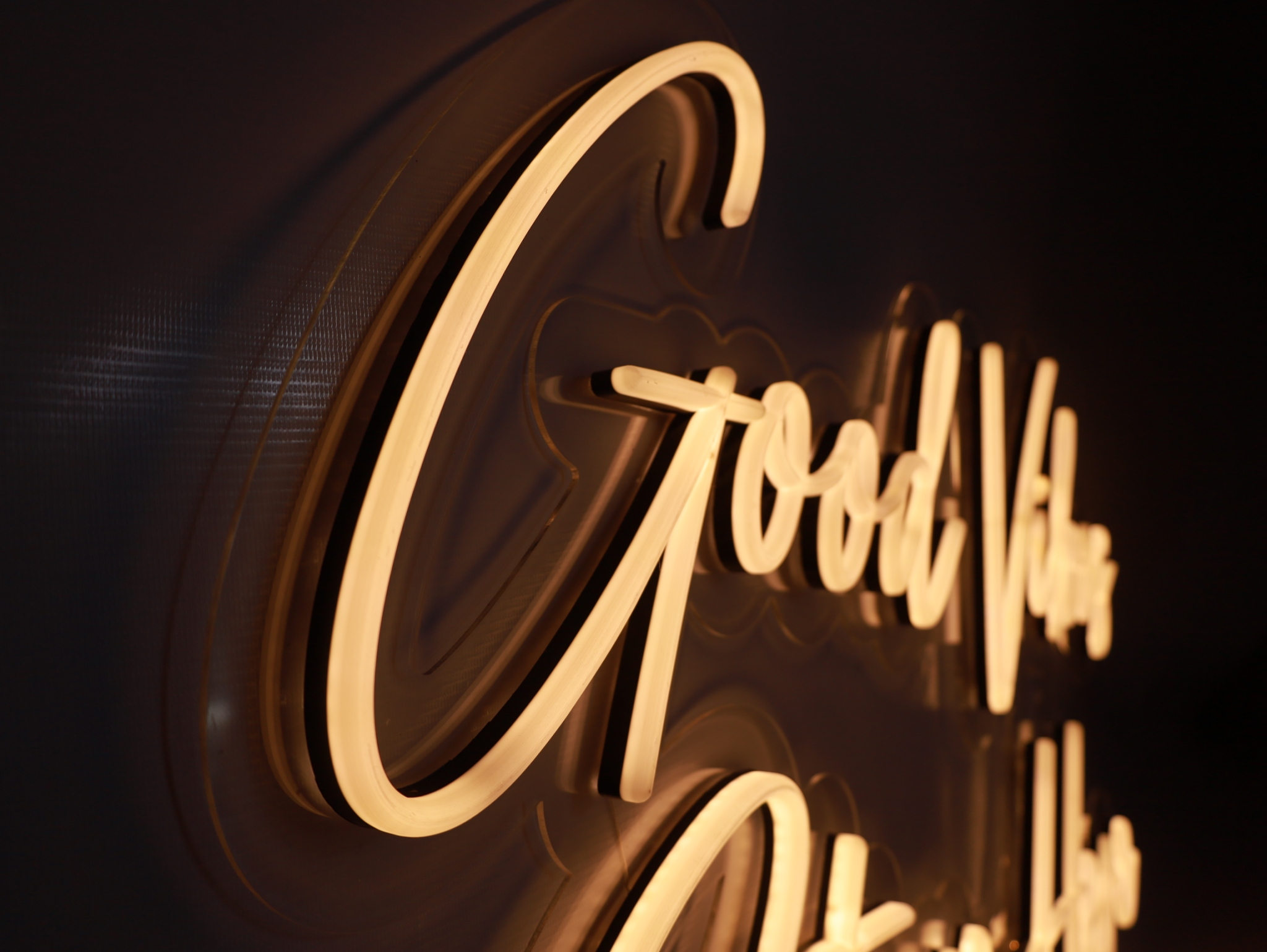 Warm Good Vibes neon script sign