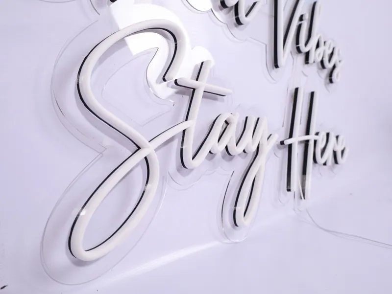 Script-style Stay High sign with a soft neon look